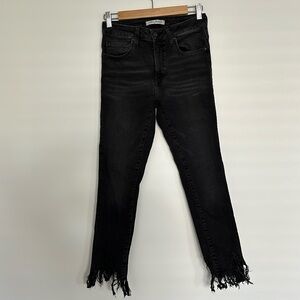 Skinny jeans with tethered ankle detail